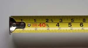 A tape measure showing 40 centimeters aligned with inch markings.